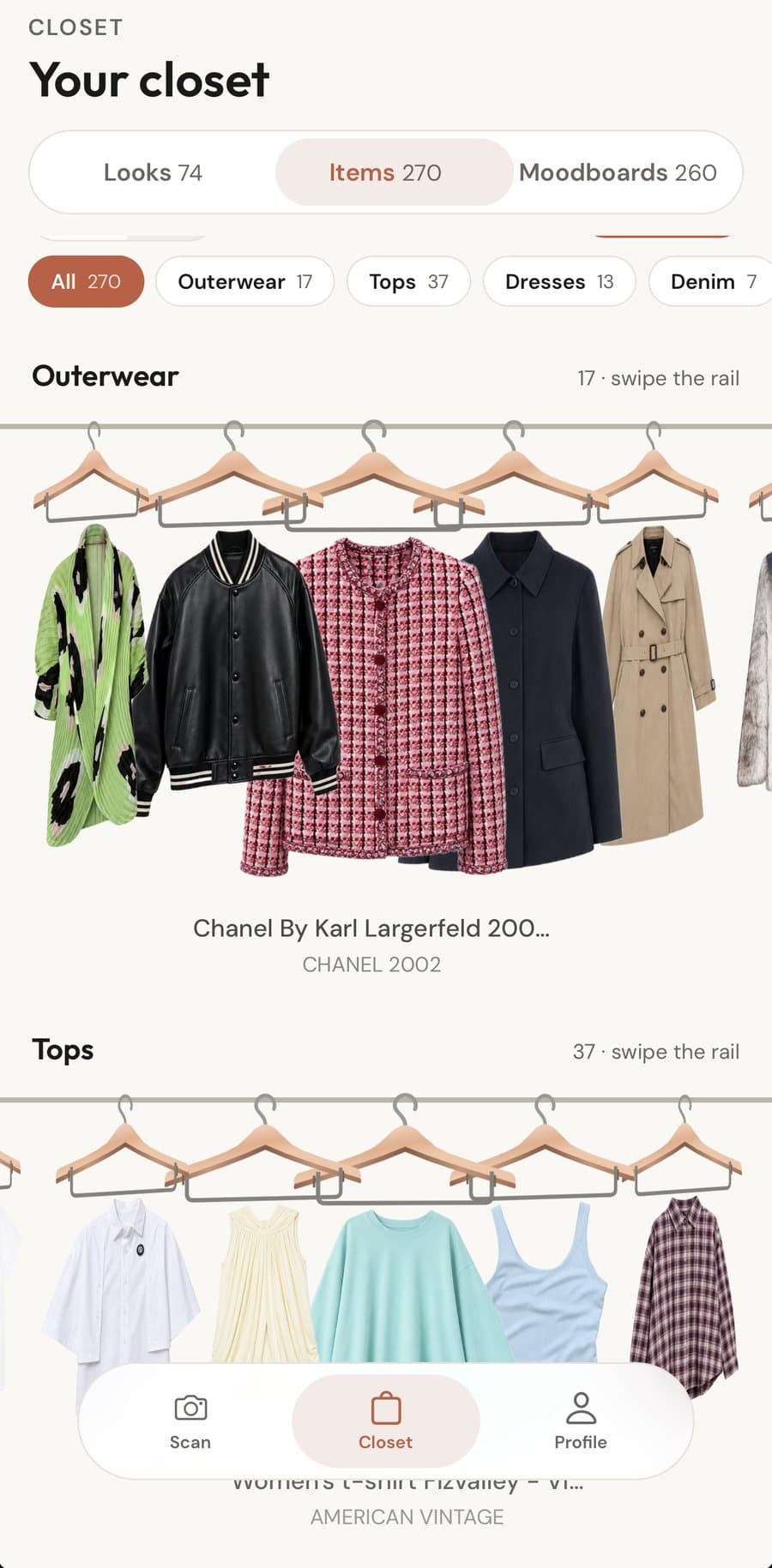 The closet: jackets and tops hanging on a wooden rail